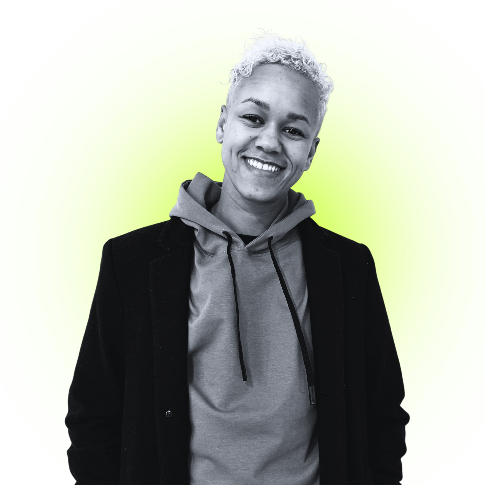 Bria Jackson, founder of Nonprofit Impact Collective, smiling in front of a lime glow